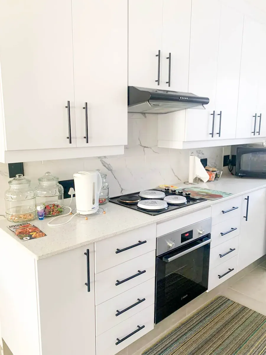 Compact white kitchen with cooking range – Brackenhurst, Alberton
